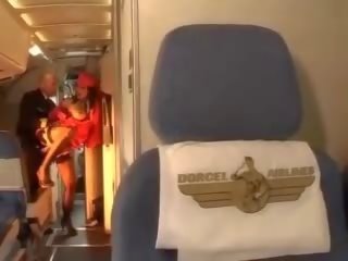 Hard up stewardess rides a cock inside both holes