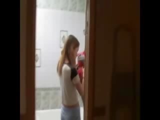 Skinny young female masturbating on the toilet