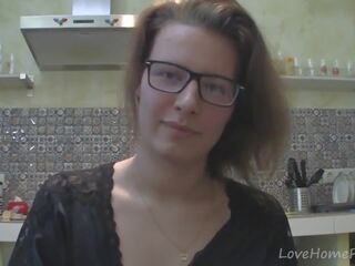 Solo mademoiselle with glasses chatting in the kitchen